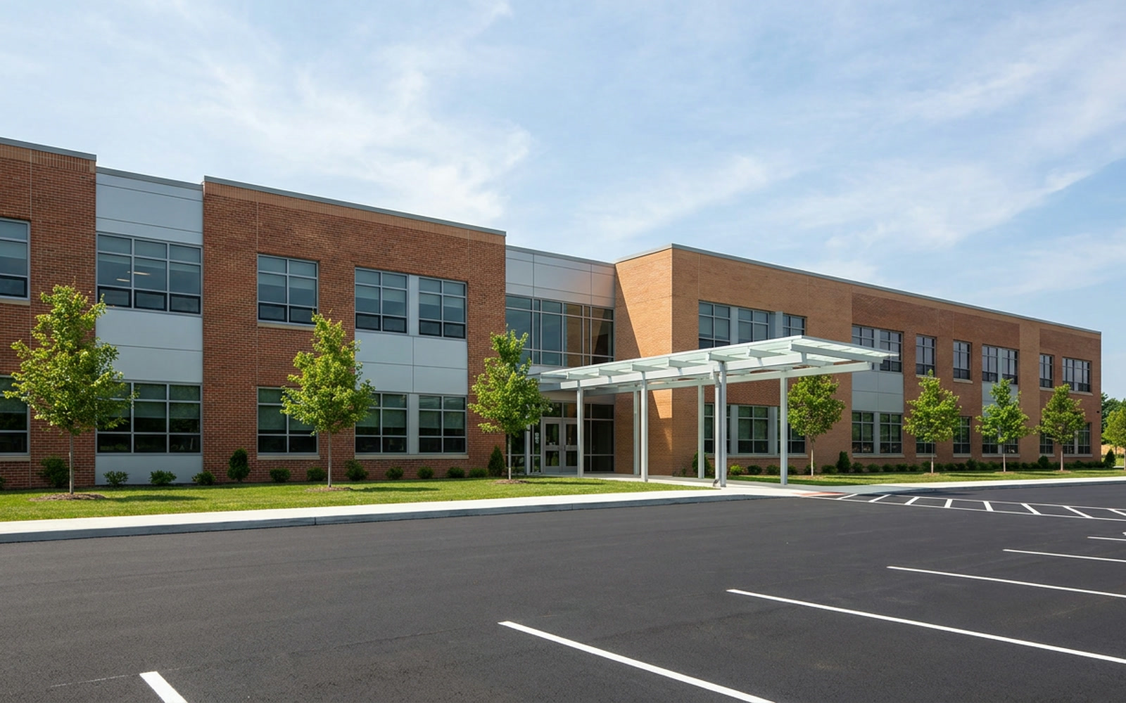 An elementary school seen from across its parking lot